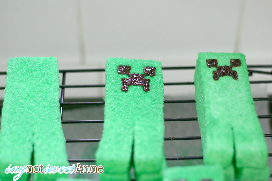 Unbelievable Minecraft Creeper Peeps! Marshmallow candies covered in green sugar are easy to make, especially with this step by step how to! These will be great for any Easter basket, or Minecraft birthday party, or even Halloween! | saynotsweetanne.com